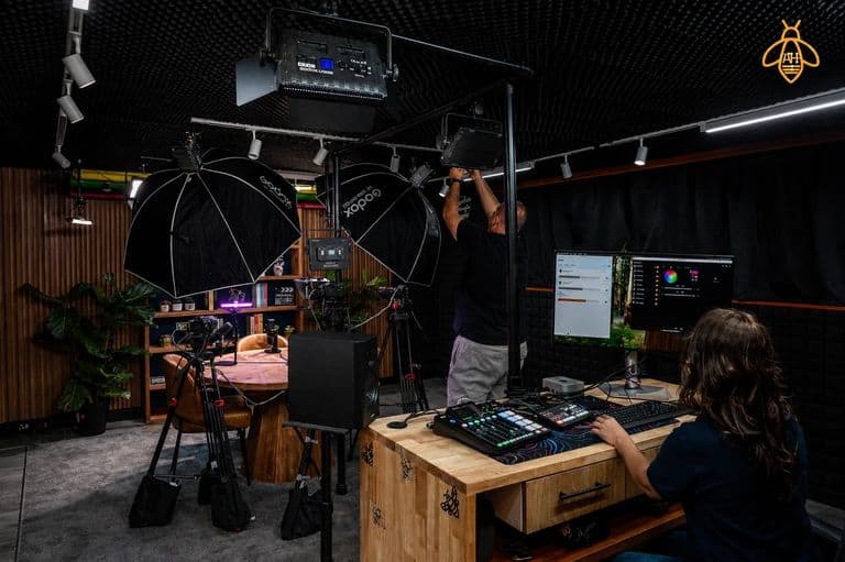 Studio floor with Godox lighting and production desk