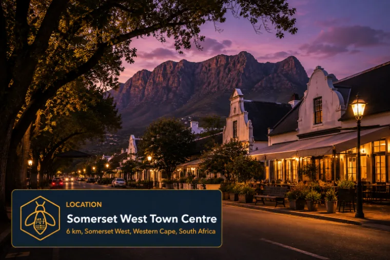 Main Road through the Somerset West town centre at dusk, Cape Dutch gables and the mountain behind