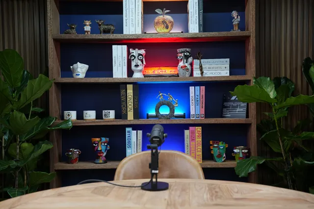 Bookshelf set dressing behind the host position